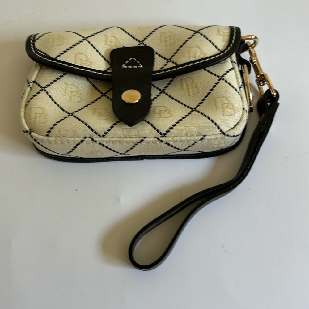 Dooney and Bourke retired pattern wristlet cream and black